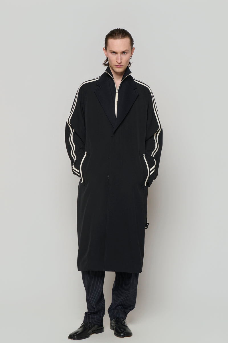 SINGLE-BREASTED RAGLAN OVERCOAT in wool gabardine with knitted collar