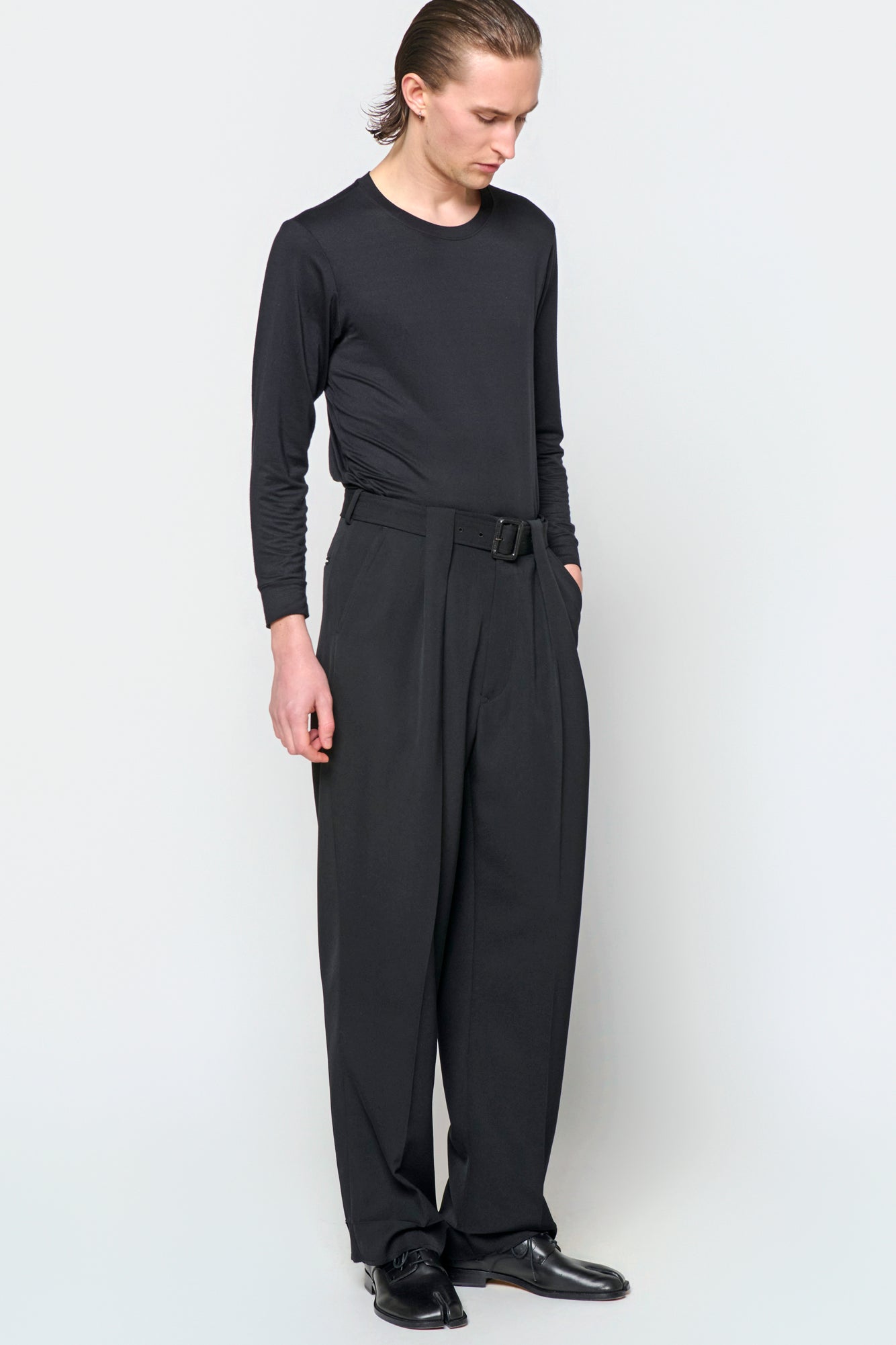 BELTED TAILORED TROUSERS in black wool gabardine