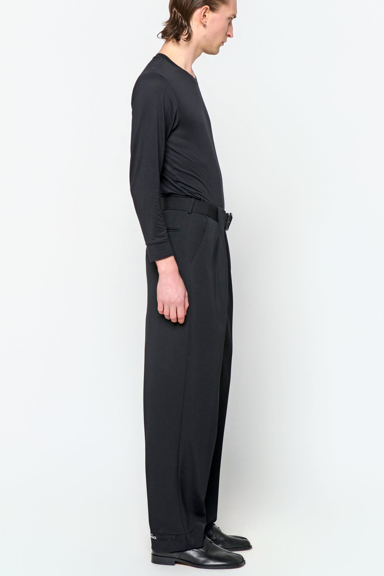 BELTED TAILORED TROUSERS in black wool gabardine