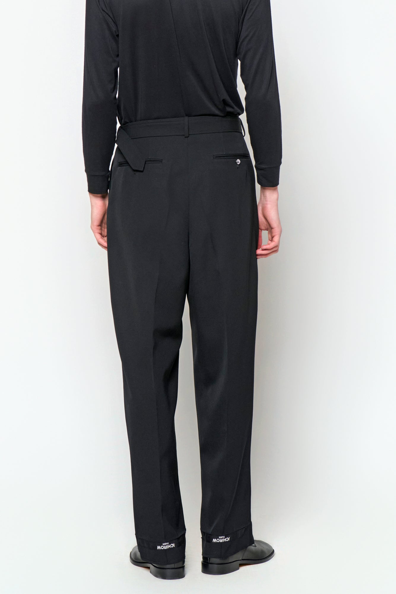 BELTED TAILORED TROUSERS in black wool gabardine