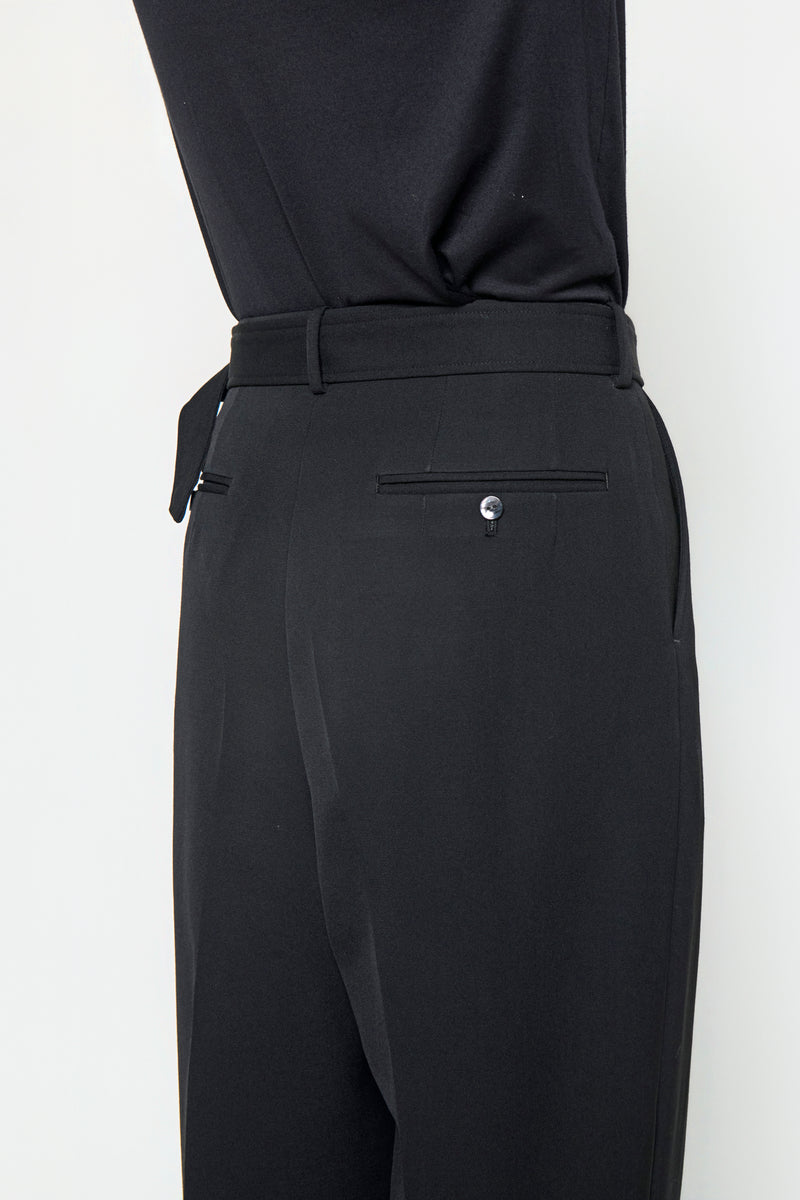 BELTED TAILORED TROUSERS in black wool gabardine